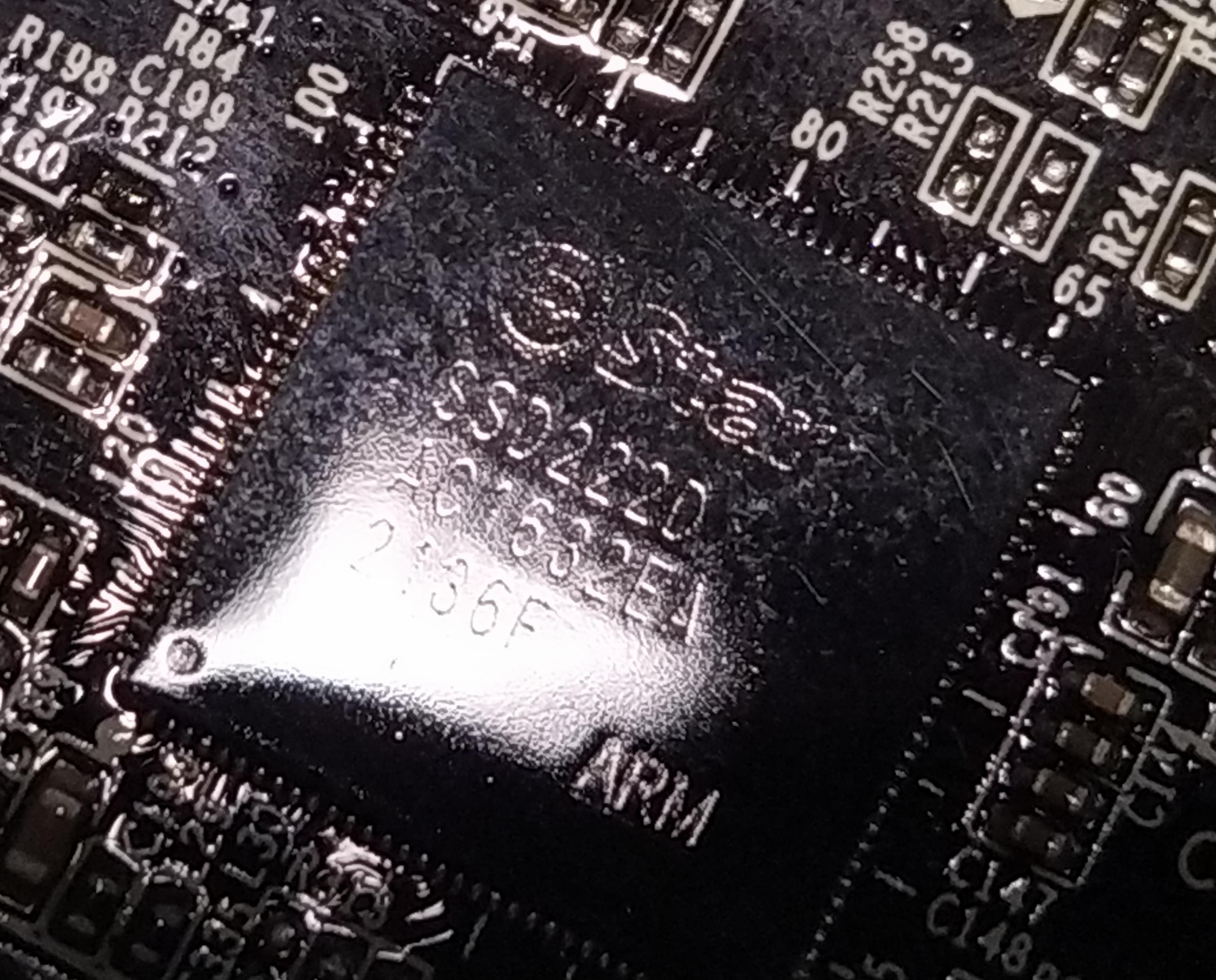 Picture of the ARM CPU with company logo and model number